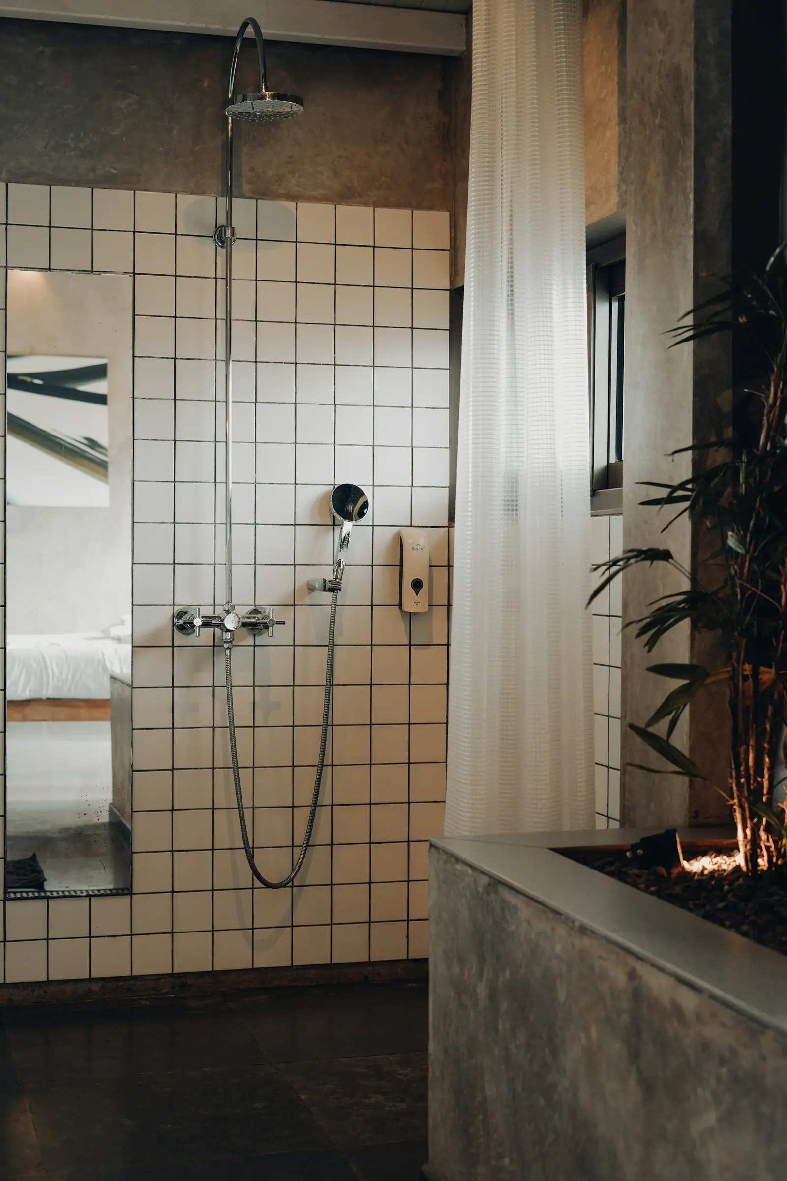 Representative image: a bathroom with tiled walls and a shower