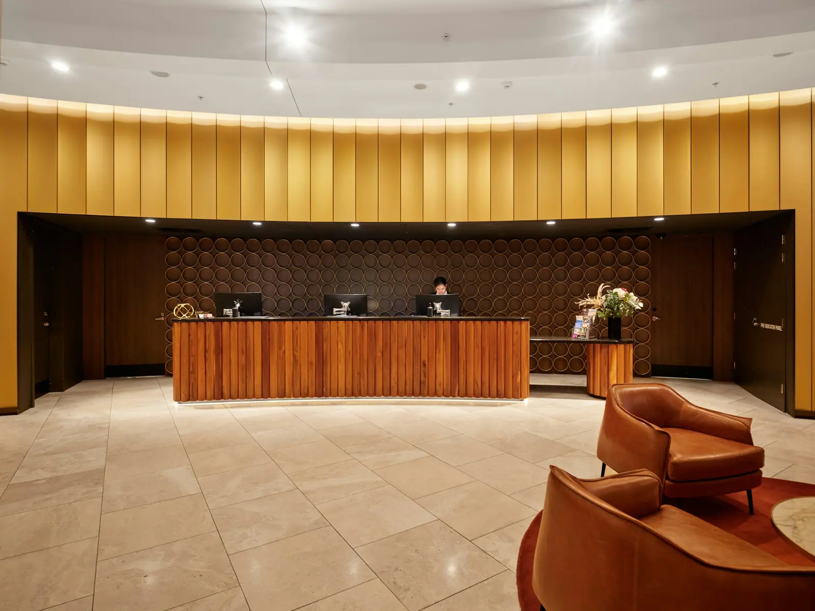 Representative image: hotel reception desk with wooden furniture and seating