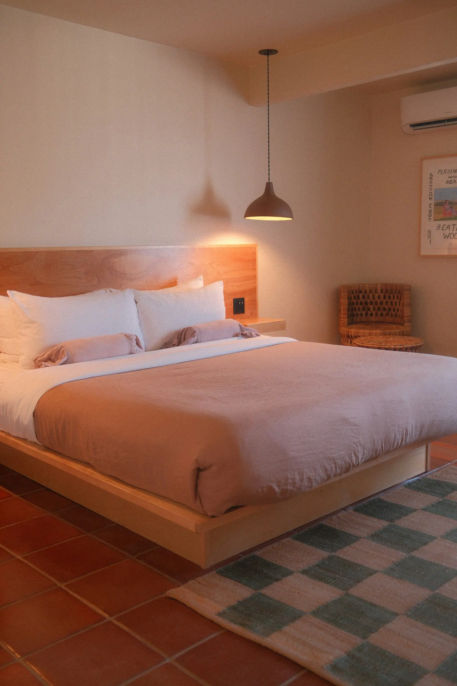 Representative image: a hotel bedroom with a large bed and warm lighting